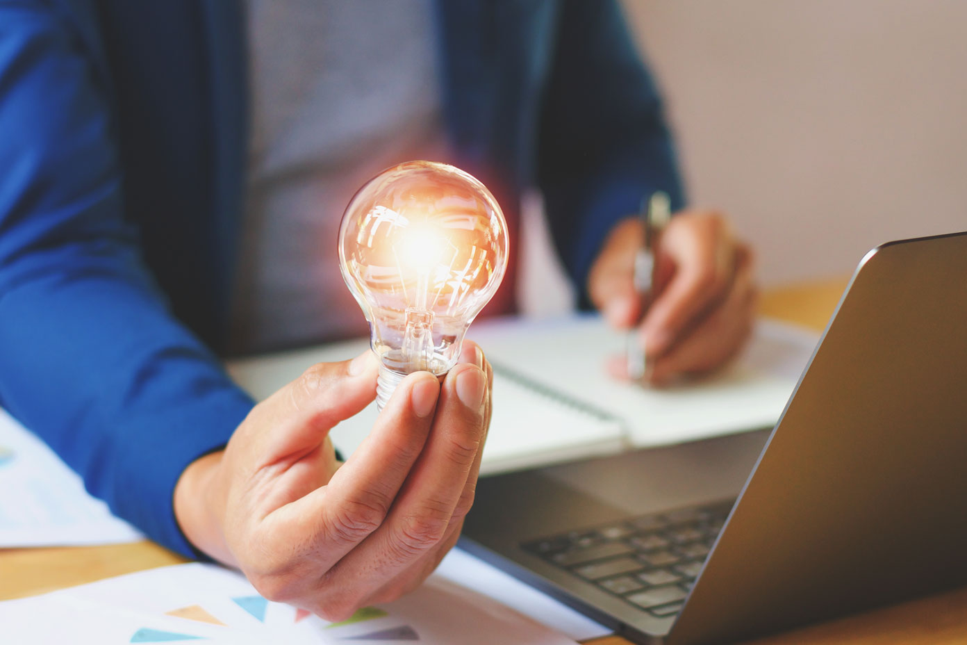 businessman holding lightbulb office